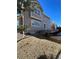 Neutral colored house exterior showing deck with a large backyard and blue sky at 1148 S Duquesne Cir, Aurora, CO 80018