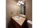 Cozy bathroom featuring a single sink vanity and neutral color palette at 1148 S Duquesne Cir, Aurora, CO 80018