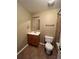 Cozy bathroom featuring a vanity, toilet and shower/tub combination with tile surround at 1148 S Duquesne Cir, Aurora, CO 80018
