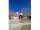 Charming two-story home with stone accents, a well-manicured lawn, and a two-car garage at 1148 S Duquesne Cir, Aurora, CO 80018