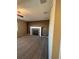 Comfortable living room showcasing a cozy fireplace, neutral carpet, and large window at 1148 S Duquesne Cir, Aurora, CO 80018