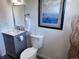 Elegant bathroom with a granite vanity, toilet, and modern fixtures at 4382 S Xenon St, Morrison, CO 80465