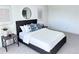 Modern bedroom with a stylish bed, neutral tones, and minimalist decor at 4382 S Xenon St, Morrison, CO 80465