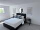 Bright bedroom featuring a contemporary bed, clean lines, and simple decor at 4382 S Xenon St, Morrison, CO 80465