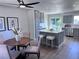 Open-concept kitchen and dining area with modern finishes and plenty of natural light at 4382 S Xenon St, Morrison, CO 80465