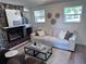 Comfortable living room boasts a stone fireplace, plush seating, and natural light at 4382 S Xenon St, Morrison, CO 80465