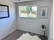 Bright office space with a large window, hardwood floors, and simple decor at 4382 S Xenon St, Morrison, CO 80465