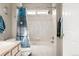 Bright bathroom featuring a shower-tub combo with tiled walls and a decorative shower curtain at 6840 Xavier Cir # 5, Westminster, CO 80030