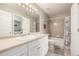 Bright bathroom features long countertop, mirror, and tiled shower-tub combo at 6840 Xavier Cir # 5, Westminster, CO 80030