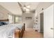 Cozy bedroom with a vaulted ceiling, skylight, hardwood floors, and neutral decor at 6840 Xavier Cir # 5, Westminster, CO 80030