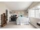 Bedroom with neutral tones, a window for natural light, and a functional workspace at 6840 Xavier Cir # 5, Westminster, CO 80030