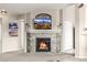 Beautiful stone fireplace with a mounted TV, flanked by candles and decorative accents at 6840 Xavier Cir # 5, Westminster, CO 80030