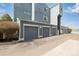 Row of detached garages with grey doors in a residential complex at 6840 Xavier Cir # 5, Westminster, CO 80030