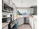 Well-lit kitchen with stainless steel appliances, a corner sink, and ample counter space at 6840 Xavier Cir # 5, Westminster, CO 80030