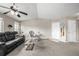 Bright and airy living room featuring a ceiling fan and a comfortable seating arrangement at 6840 Xavier Cir # 5, Westminster, CO 80030