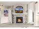 Living room featuring a stone fireplace with a TV mounted above, and access to other rooms at 6840 Xavier Cir # 5, Westminster, CO 80030