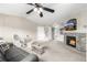 Inviting living room with a stone fireplace, mounted TV, and cozy seating area at 6840 Xavier Cir # 5, Westminster, CO 80030