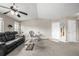 Bright and inviting living room with comfortable seating, a ceiling fan, and stylish decor at 6840 Xavier Cir # 5, Westminster, CO 80030