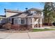 Charming townhome exterior with covered porch, natural light, and professional landscaping at 7524 Pineridge Trl, Castle Pines, CO 80108