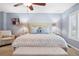 Calm main bedroom with a decorative bed, soft lighting, and a comfortable seating area near the window at 7524 Pineridge Trl, Castle Pines, CO 80108