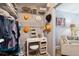 Walk-in closet with built-in desk and organization shelves, great for storage and home organization at 7524 Pineridge Trl, Castle Pines, CO 80108