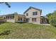 Large backyard with green lawn and siding and brick house at 2552 E 126Th Way, Thornton, CO 80241