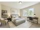 Serene bedroom with a large window, desk, and stylish decor at 2552 E 126Th Way, Thornton, CO 80241