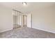 This bedroom has a closet with mirrored doors and an open entry to the rest of the house at 2552 E 126Th Way, Thornton, CO 80241