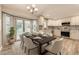Eat-in kitchen and dining space with modern pendant lighting and backyard access at 2552 E 126Th Way, Thornton, CO 80241