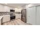 Contemporary kitchen equipped with stainless steel appliances, sleek cabinetry, and modern backsplash at 2552 E 126Th Way, Thornton, CO 80241