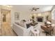 Bright living room featuring a fireplace, neutral decor, and comfortable seating at 2552 E 126Th Way, Thornton, CO 80241