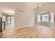 Open-concept living space features modern flooring, neutral paint, and a seamless flow to the outdoors at 2552 E 126Th Way, Thornton, CO 80241