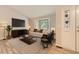Bright living room with bay window, modern decor and neutral color palette at 2552 E 126Th Way, Thornton, CO 80241