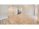 Spacious living room features modern flooring, neutral paint, and a staircase with metal accents at 2552 E 126Th Way, Thornton, CO 80241