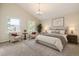 Spacious bedroom boasts vaulted ceilings, soft carpet, and serene ambiance at 2552 E 126Th Way, Thornton, CO 80241
