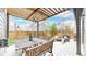 Backyard view featuring a patio with dining and lounging areas, perfect for outdoor gatherings at 9437 E 51St Dr, Denver, CO 80238