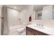 Well-lit bathroom featuring a tub and a single sink vanity at 9437 E 51St Dr, Denver, CO 80238