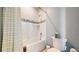 Clean bathroom with a shower-tub and a toilet and tissue paper at 9437 E 51St Dr, Denver, CO 80238