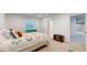 Cozy bedroom with window, turquoise dresser, and quilt comforter at 9437 E 51St Dr, Denver, CO 80238