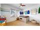 Bright bedroom with a customized bed and sports memorabilia hanging on the wall at 9437 E 51St Dr, Denver, CO 80238