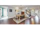 Beautiful dining room with modern light fixture, elegant decor, and staircase access at 9437 E 51St Dr, Denver, CO 80238