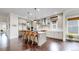Bright kitchen with a center island, stainless steel appliances, and hardwood floors at 9437 E 51St Dr, Denver, CO 80238