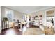Spacious office with hardwood floors, bookshelves, and natural light from the windows at 9437 E 51St Dr, Denver, CO 80238