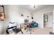 Bright office space with desk, guitars, and printer at 9437 E 51St Dr, Denver, CO 80238