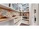Well-organized pantry with custom shelving, butcher block countertops, and stylish decor at 9437 E 51St Dr, Denver, CO 80238