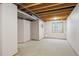 Unfinished basement with visible piping, ductwork, and one window at 9938 Grove Way # B, Westminster, CO 80031