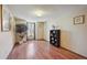 Bright bedroom with hardwood floors, natural light and serene tree views at 9938 Grove Way # B, Westminster, CO 80031