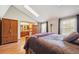 Bright bedroom features skylight, wood floors and attached bath at 9938 Grove Way # B, Westminster, CO 80031