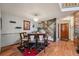 Cozy dining room with a staircase, modern chandelier, and vibrant accents at 9938 Grove Way # B, Westminster, CO 80031