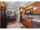 Well-designed kitchen with stainless appliances and view to dining area and staircase at 9938 Grove Way # B, Westminster, CO 80031